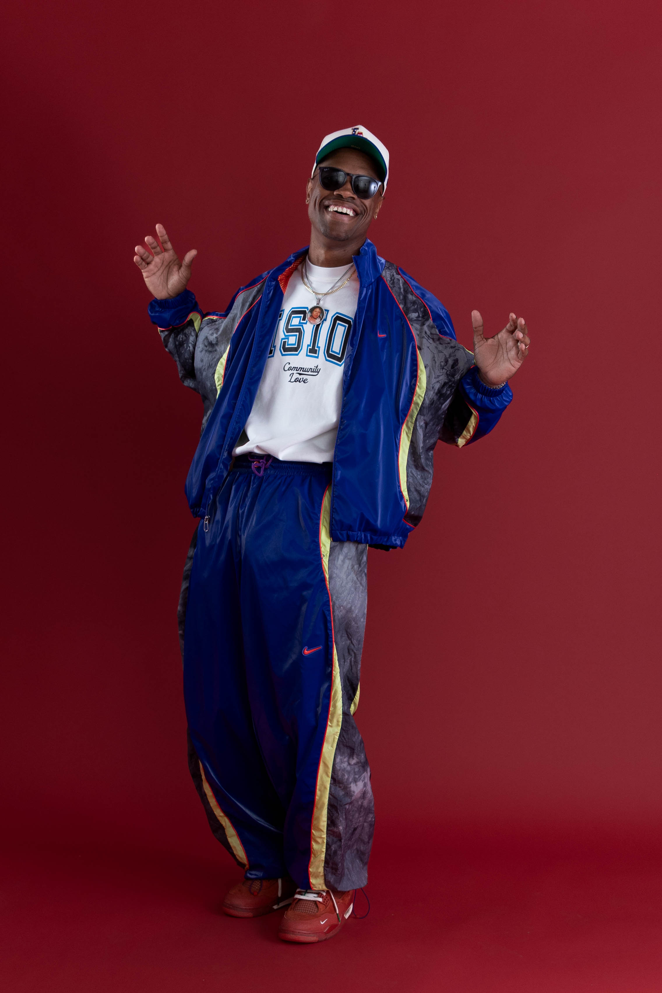 Phil Wright demonstrating movement in a blue tracksuit